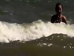 Topless and nude friend at beach on Watchteencam.com