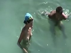 Small tits and puffy nipples nudist fucking in water on Watchteencam.com