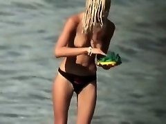 Guy splashes a topless girl with water on Watchteencam.com