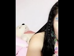 Chinese porn camgirl hiding her mouth on Watchteencam.com